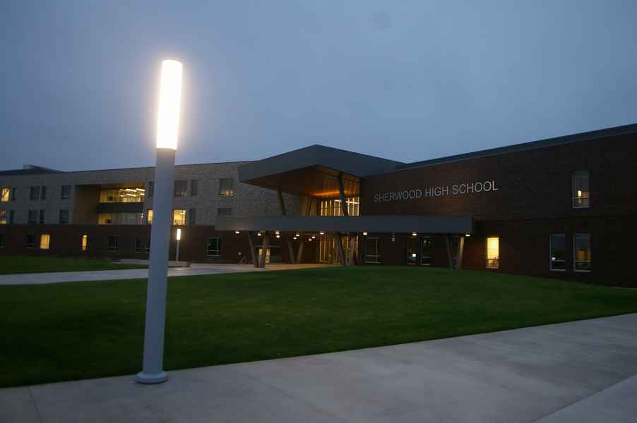 High School Entryway At Night With Lit Column