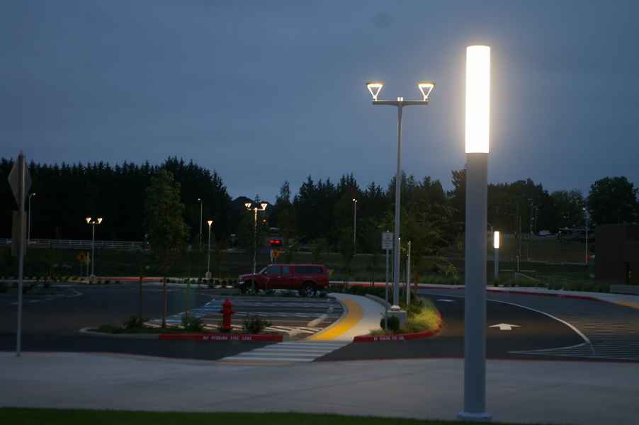 High School Parking Area At Night With Lit Column And Light Fixtures