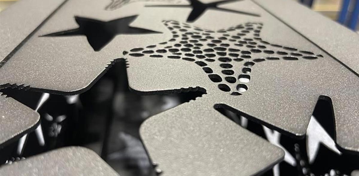 Custom Beyond The Catalog A close-up shot of custom starfish-shaped cutouts on a light column housing