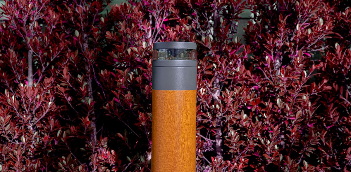 LIGHTWAVE Bollard MicroPRIM Walnut Finish Red Tree Background (1)