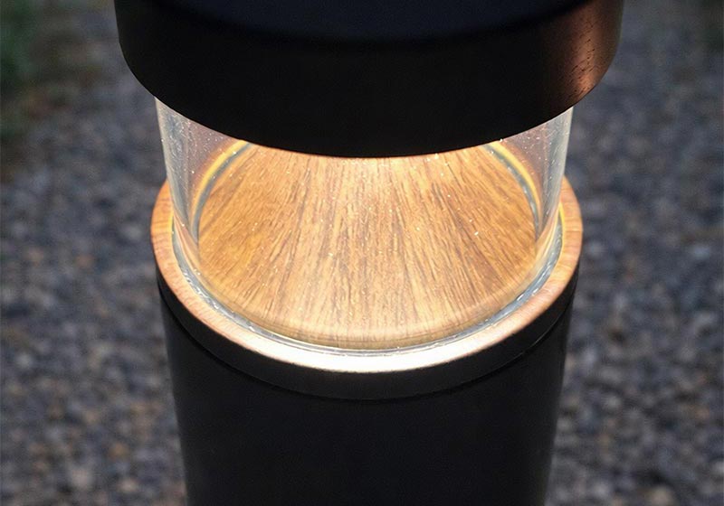 MicroPRIM™ resin finishing with a wood grain pattern on an outdoor bollard