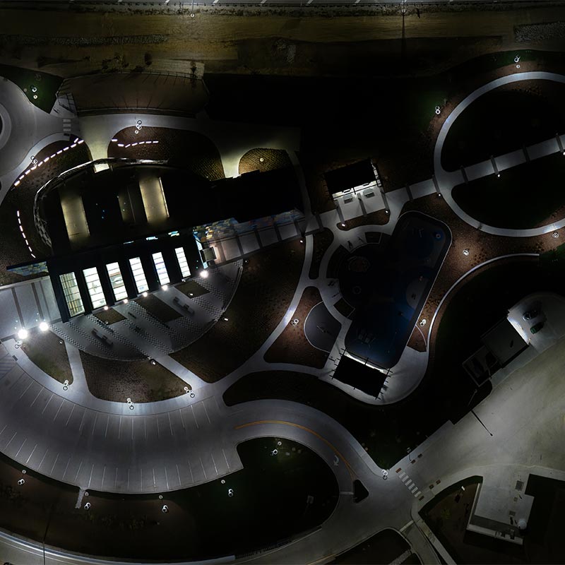 Site Assess 1 Solar lights illuminate a parking lot after dark